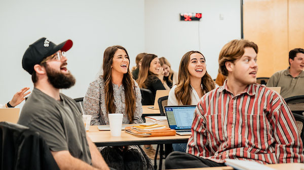 A group of Watermark Institute students having fun and laughing at a fun teaching session.